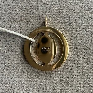 Chloe charm pendant in gold. Brand new.